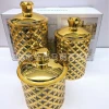 A new round sealed plastic bottle with a gold edge and diamond cap, a high-end candy jar and storage jar set of three pieces, gold-plated details Picture
